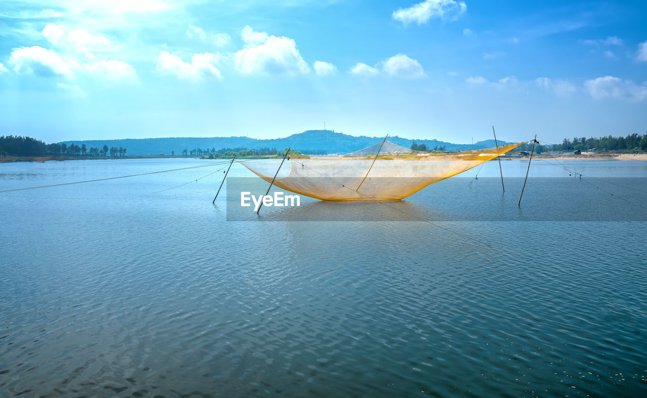 PANORAMIC VIEW OF BEACH AGAINST SKY