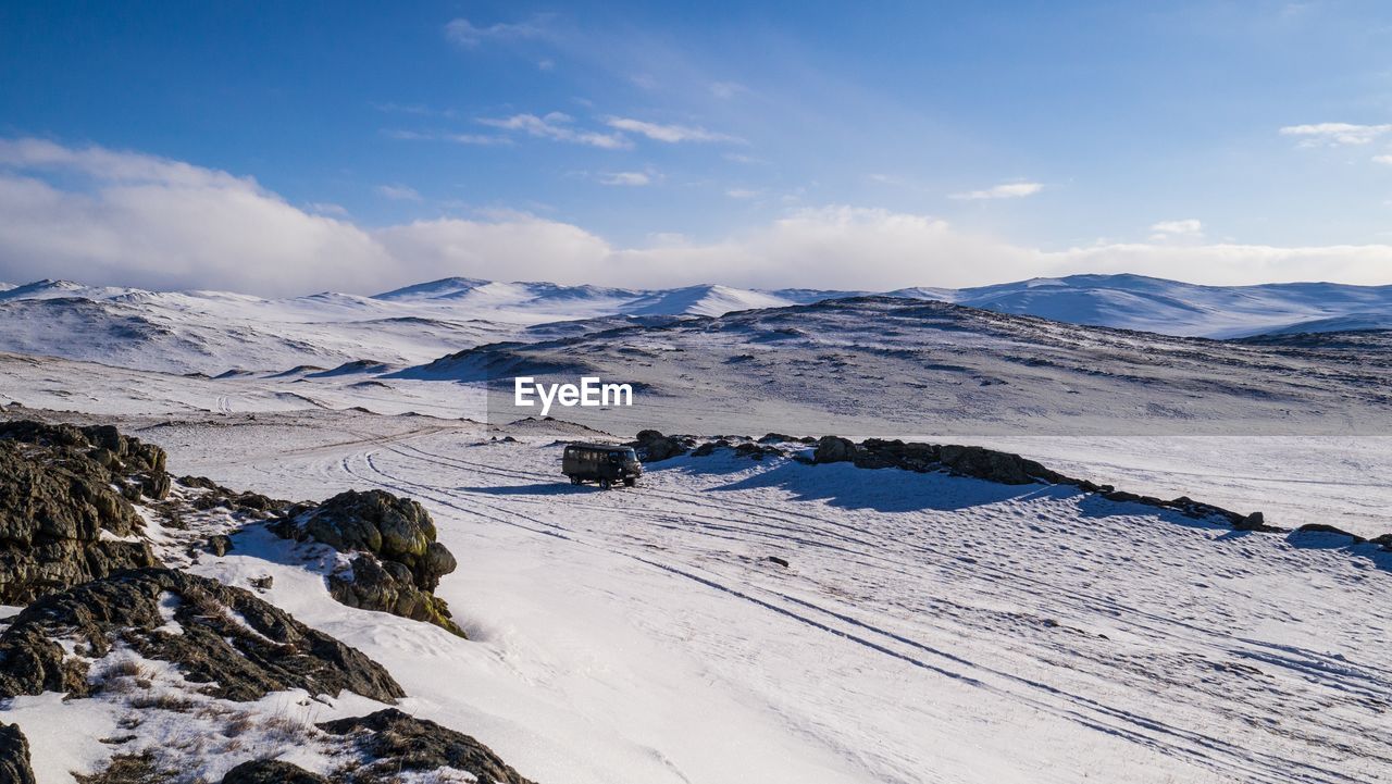 Scenic view of snow covered mountains