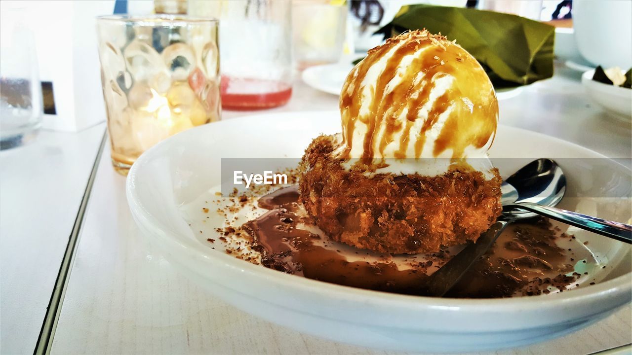 CLOSE-UP OF DESSERT ON TABLE