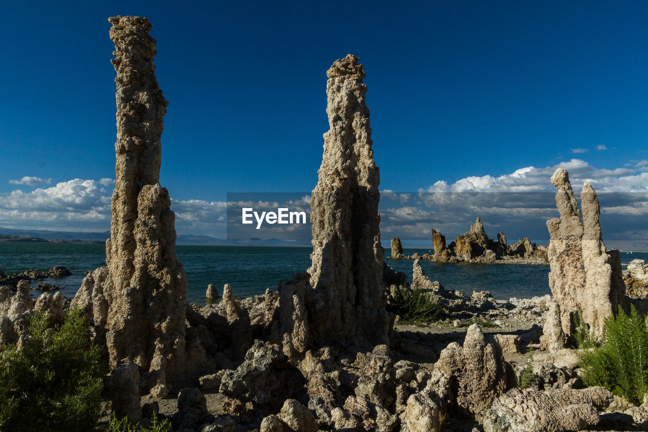 Scenic view of mono lake against blue sky
