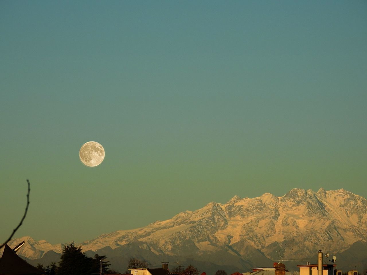 Low angle view of moon against clear sky at night