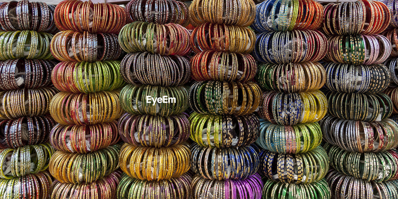 Full frame shot of multi colored bangles for sale