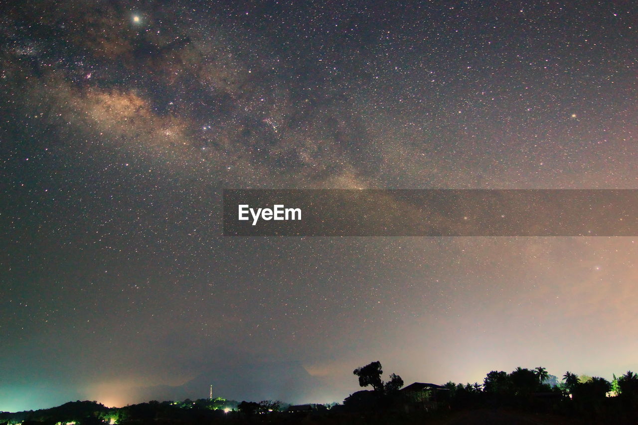 LOW ANGLE VIEW OF STAR FIELD AGAINST SKY