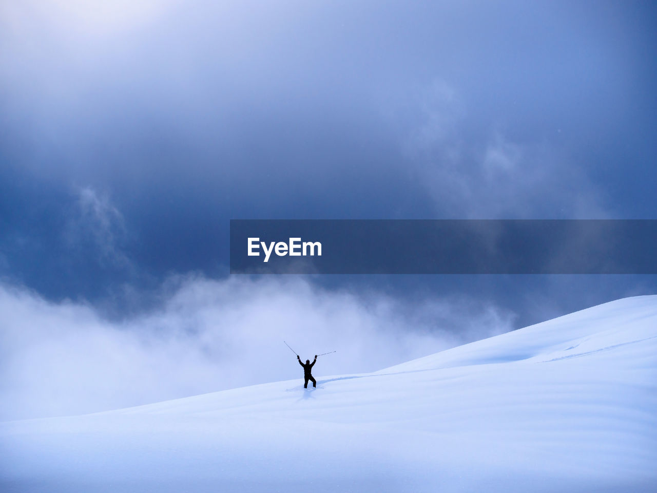 Man on snow against sky