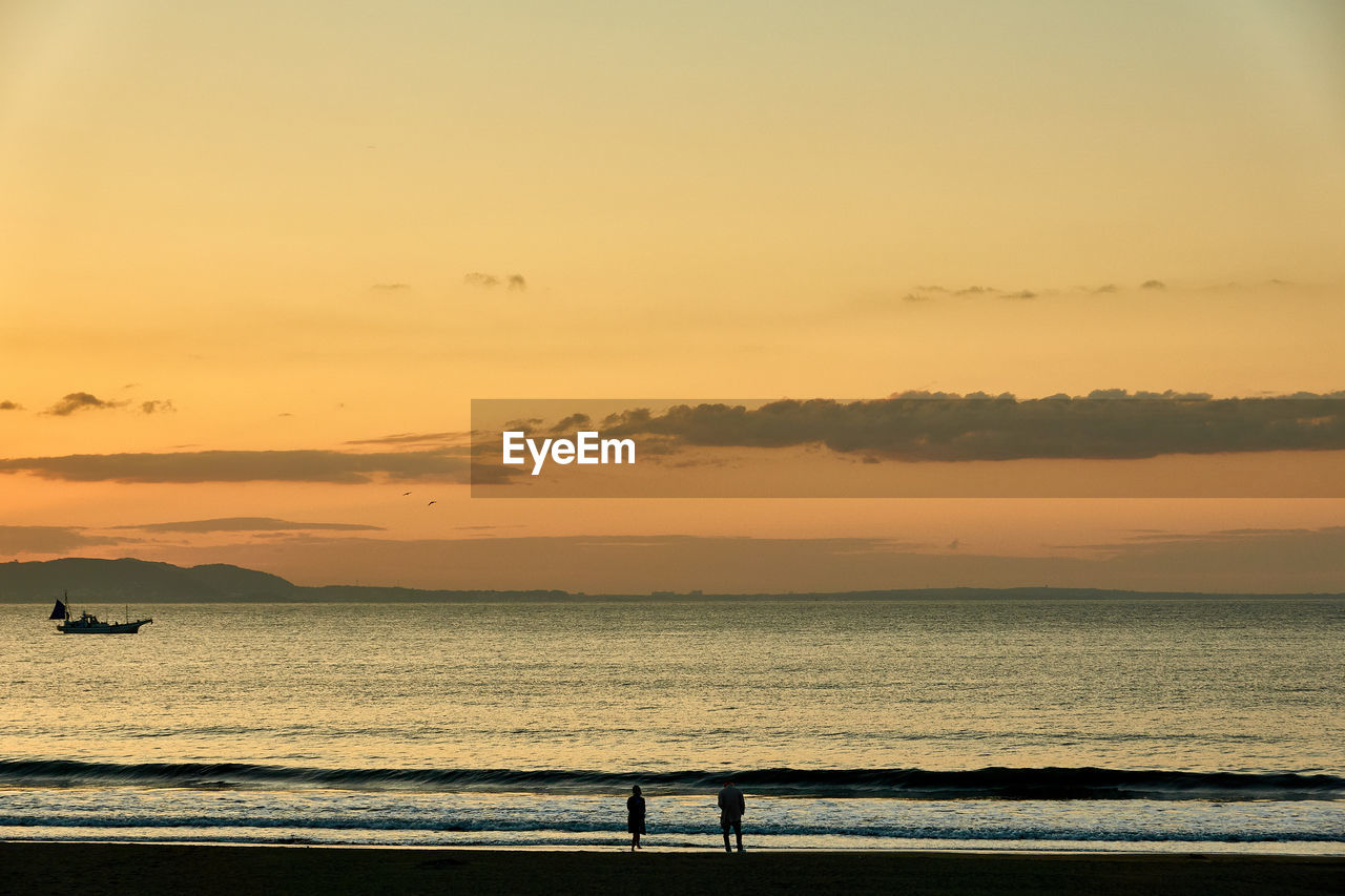 SCENIC VIEW OF SEA DURING SUNSET