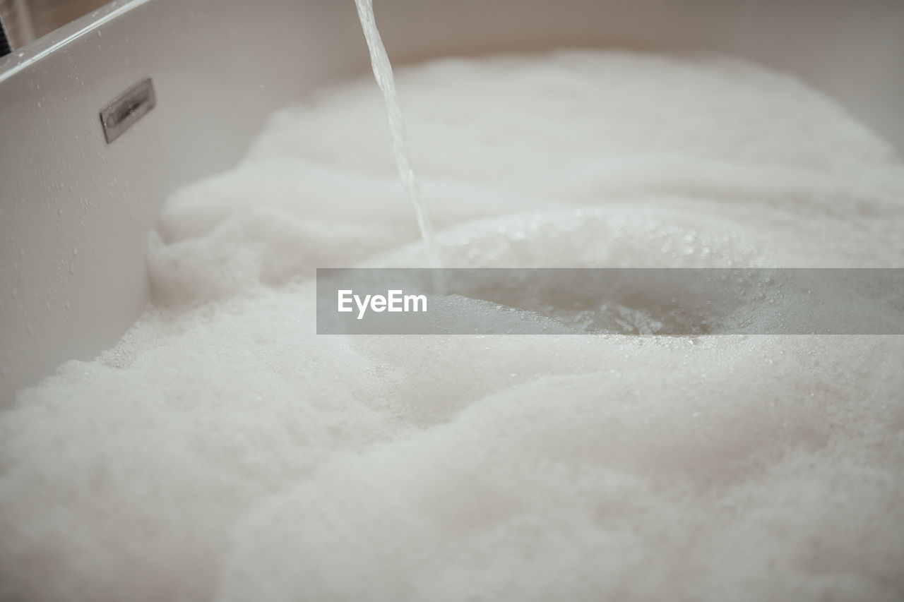 white, powdered sugar, soap sud, indoors, cleaning, close-up, hygiene, food and drink, washing, icing, skin, domestic room, bubble, selective focus, food, water, motion, household equipment, baked, freshness, pouring, no people, whipped cream, bathroom