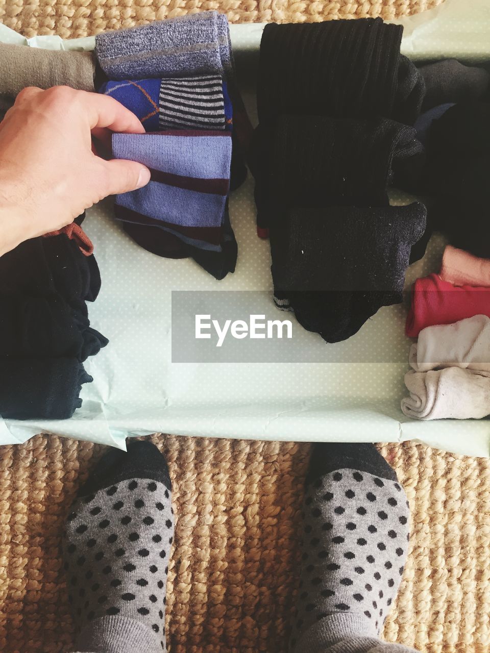 Personal perspective of person folding socks