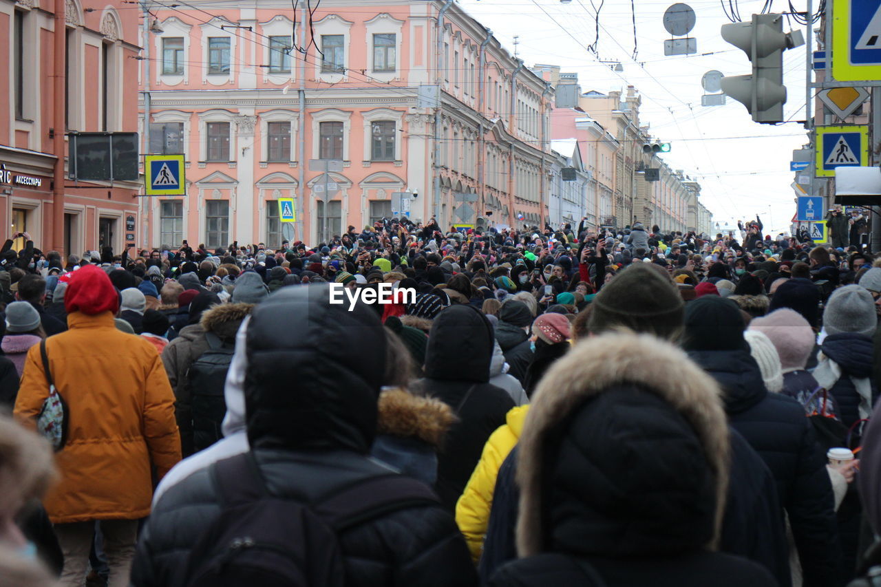 Crowd of people on street in city
