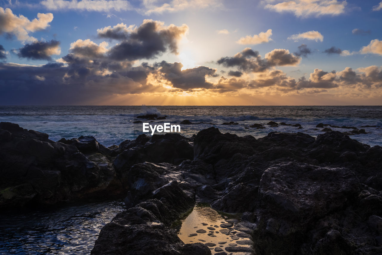 Scenic view of sea against sky during sunset