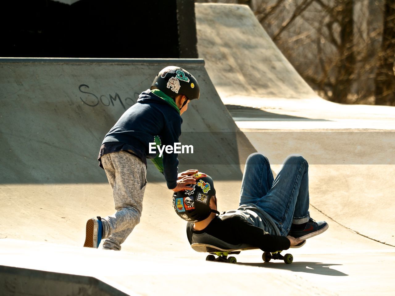 REAR VIEW OF MAN SKATEBOARDING