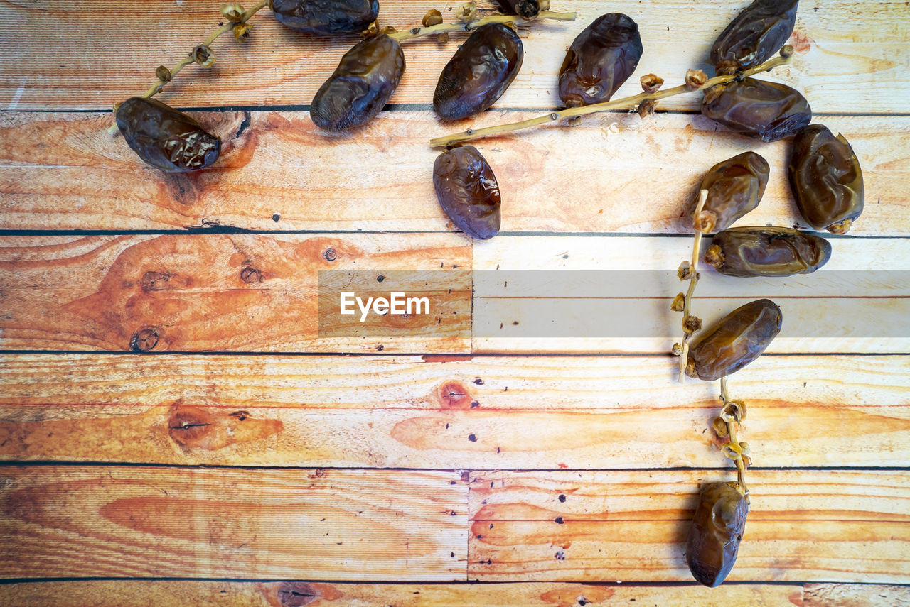 Dates fruits on wooden table. ramadan muslim concept.