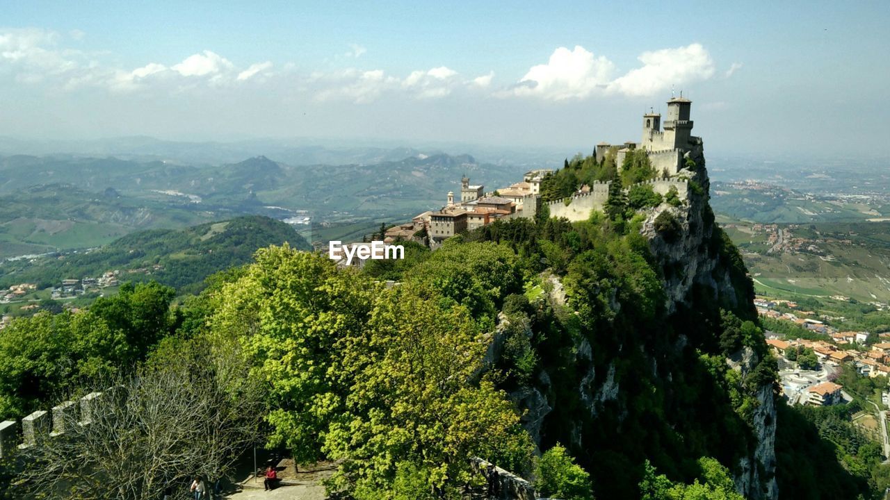 High angle view of trees and mountains against sky in san marino
