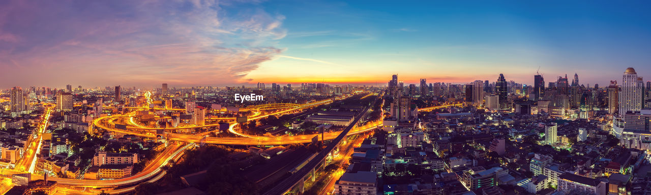 High angle view of illuminated city against sky