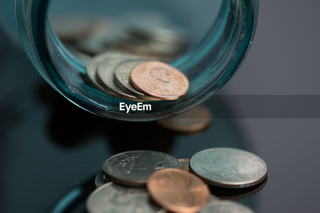 Close-up of coins on table