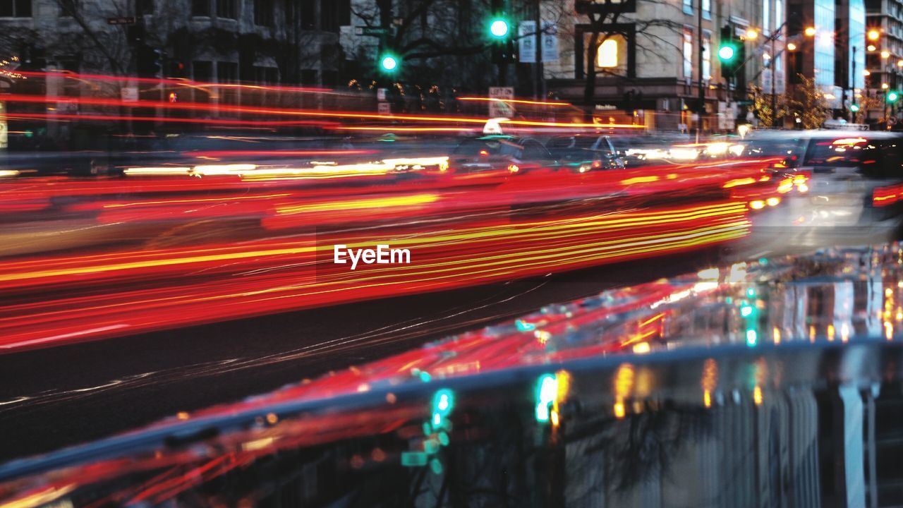 Light trails on road in city at night