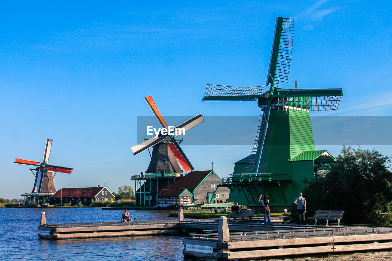 Traditional windmill against clear blue sky