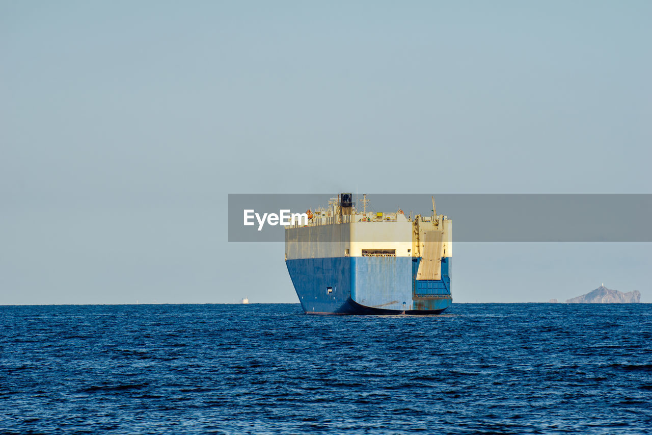 VIEW OF SHIP IN SEA AGAINST CLEAR SKY