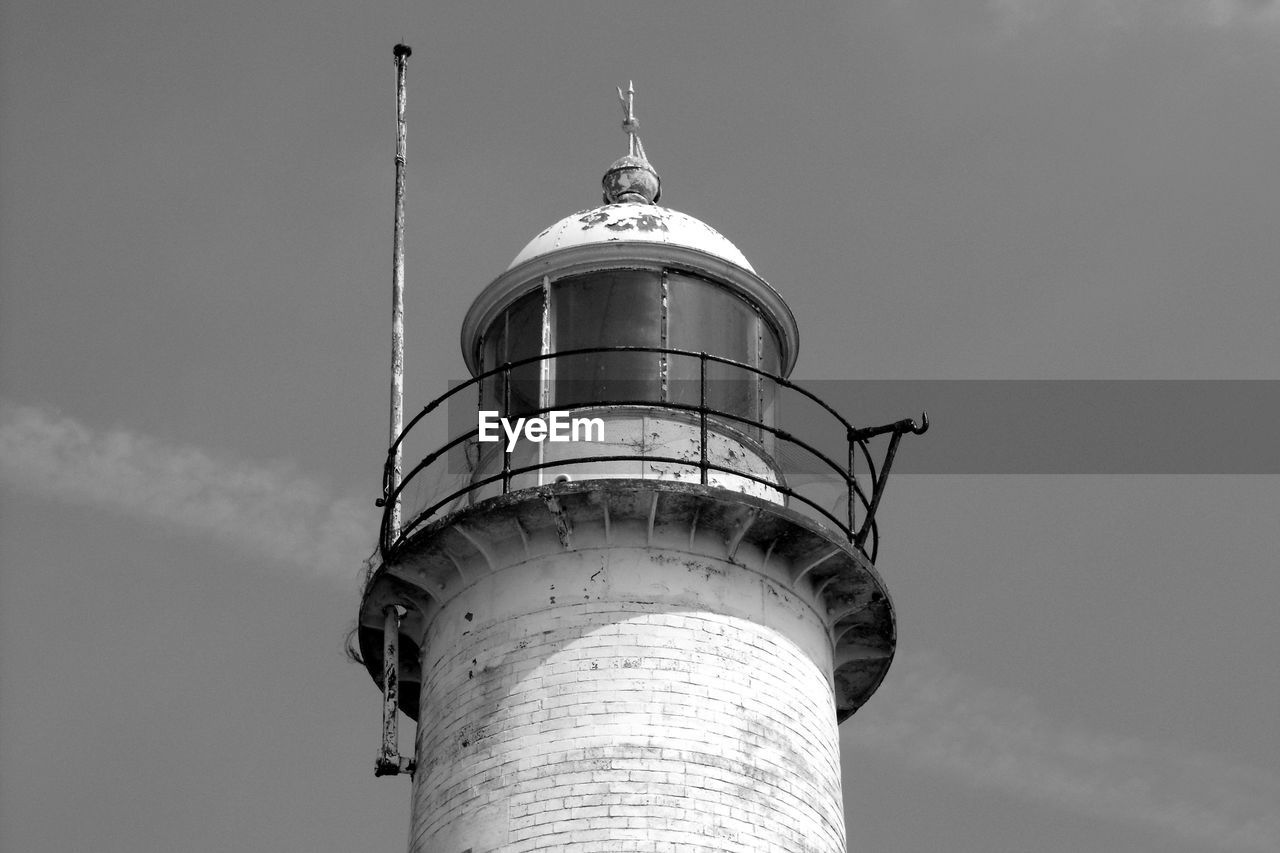 LOW ANGLE VIEW OF WATER TOWER AND LIGHTHOUSE