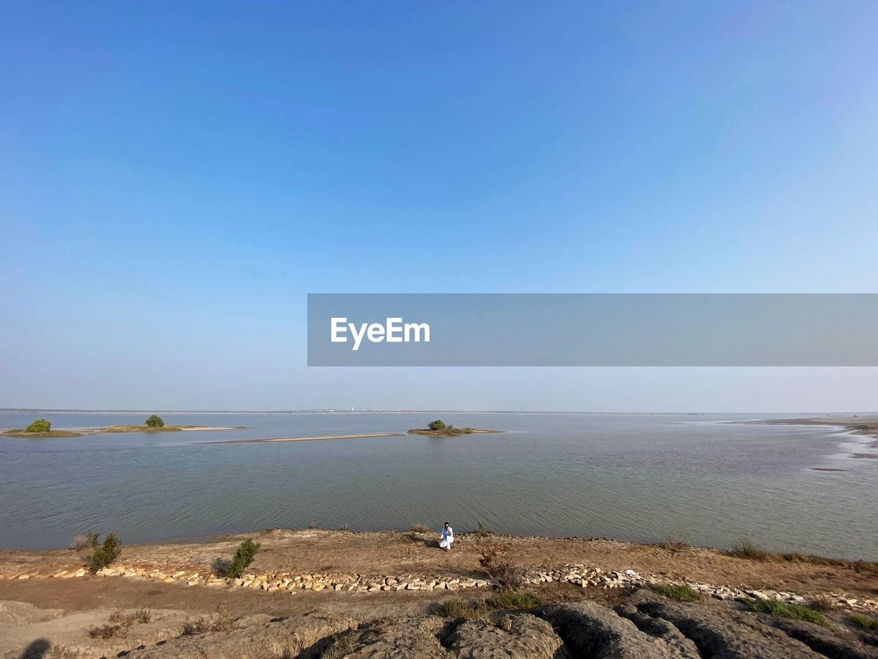 Scenic view of sea against clear blue sky