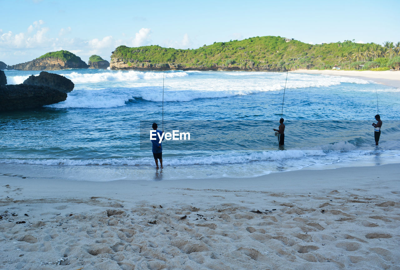 People fishing at beach