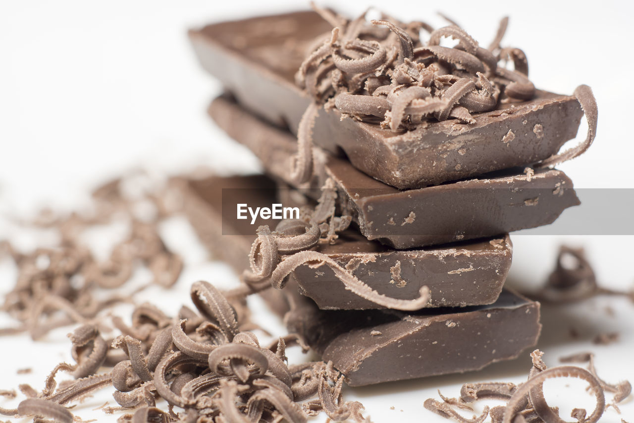 Close-up of chocolates over white background