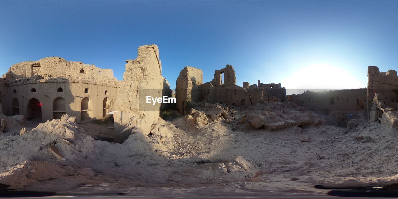 architecture, history, sky, travel destinations, the past, nature, ancient history, travel, temple, rock, built structure, ancient, land, no people, old ruin, ruins, building exterior, blue, sand, clear sky, tourism, castle, building, outdoors, landscape, landmark, ruined, desert, old, sunlight