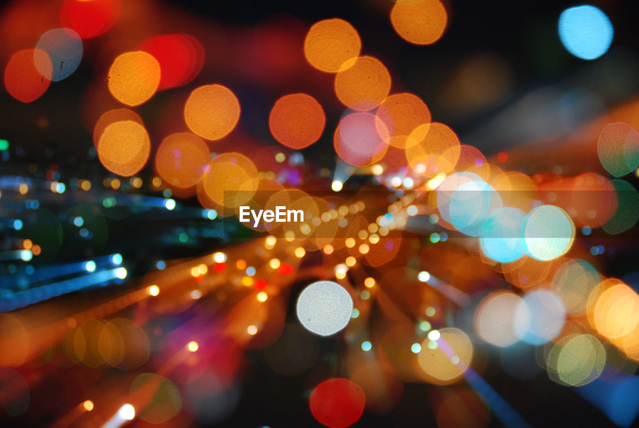 Defocused image of colorful illuminated lights at night