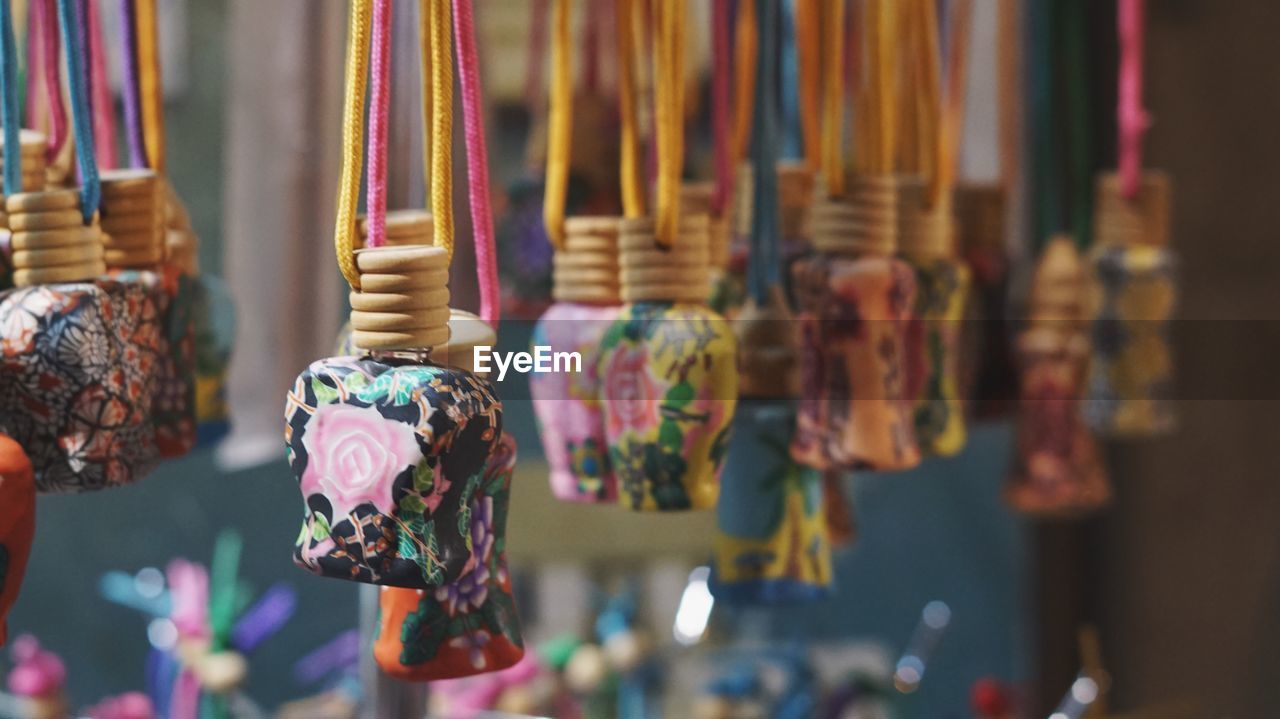 Close-up of decorative materials hanging for sale