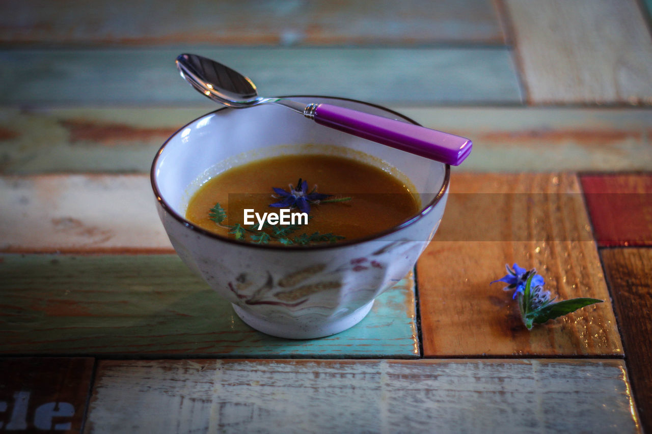 Spoon on soup bowl