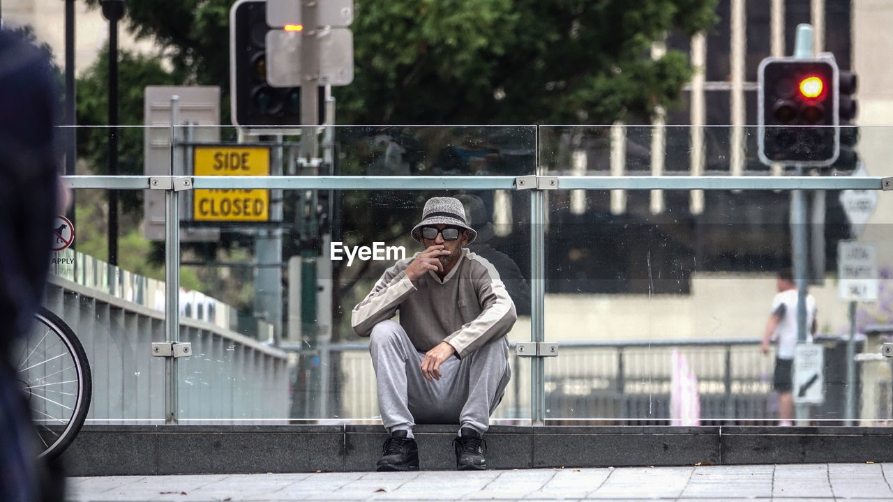 MAN ON STREET IN CITY