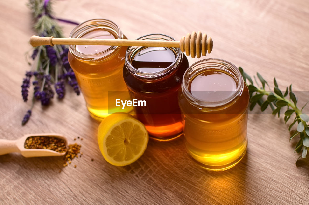 High angle view of honey jars on table