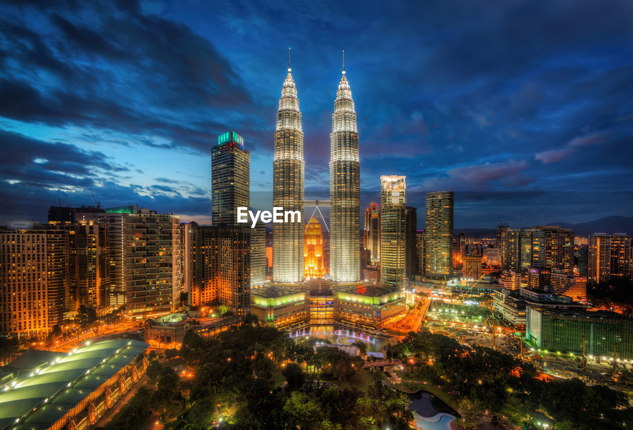 Aerial view of illuminated buildings in city at night