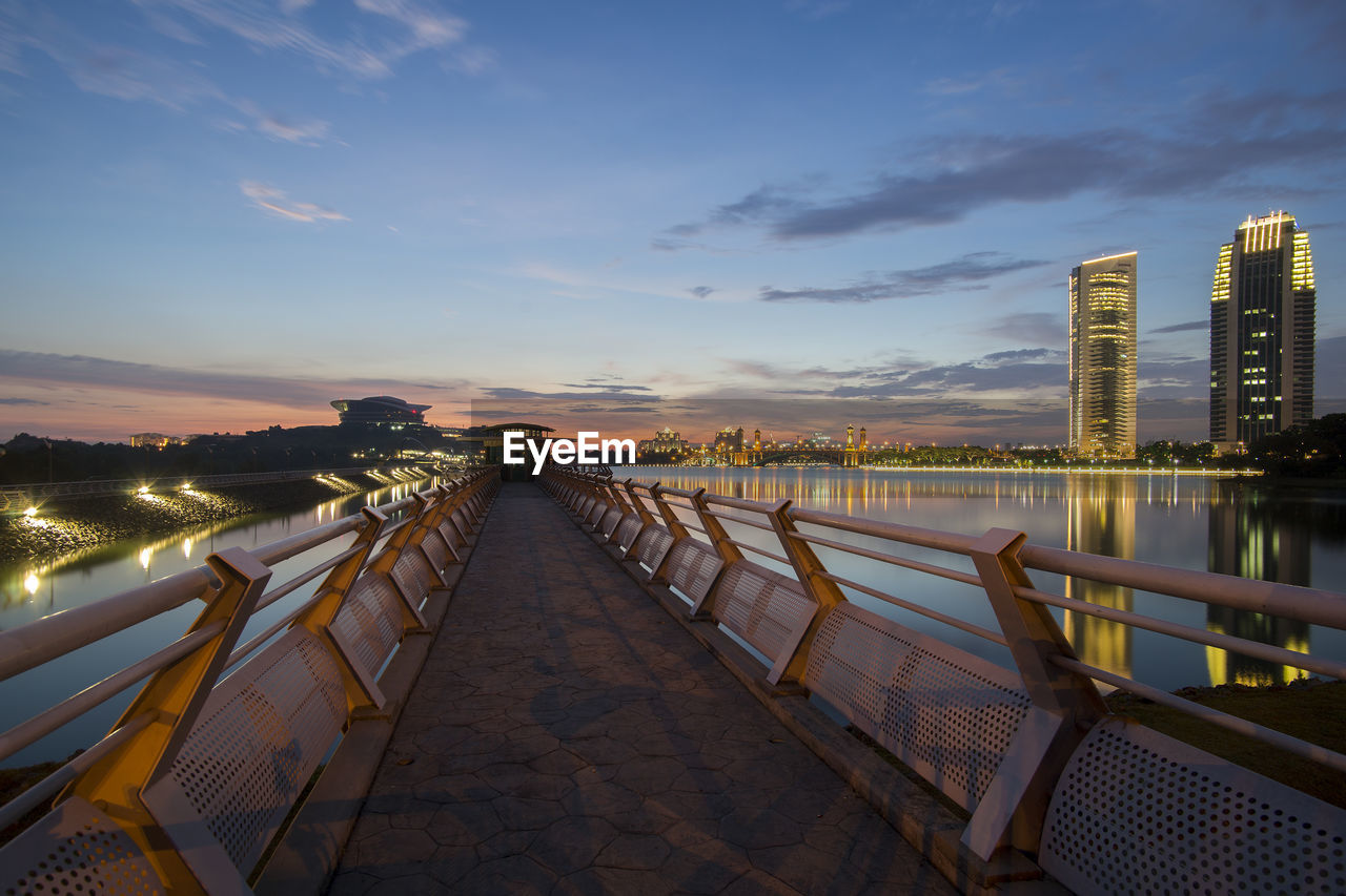 Bridge over putrajaya lake against sky during sunset