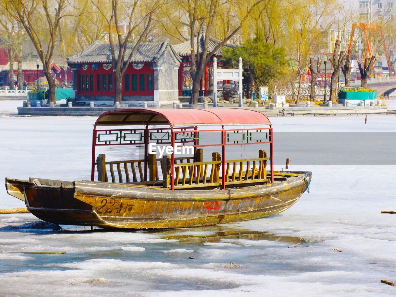 Boat on frozen lake