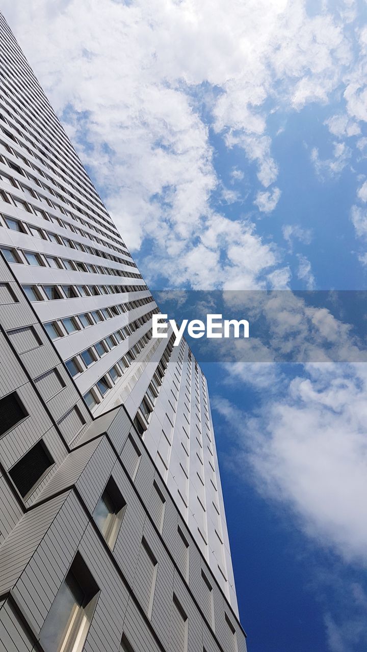 LOW ANGLE VIEW OF MODERN BUILDINGS AGAINST SKY