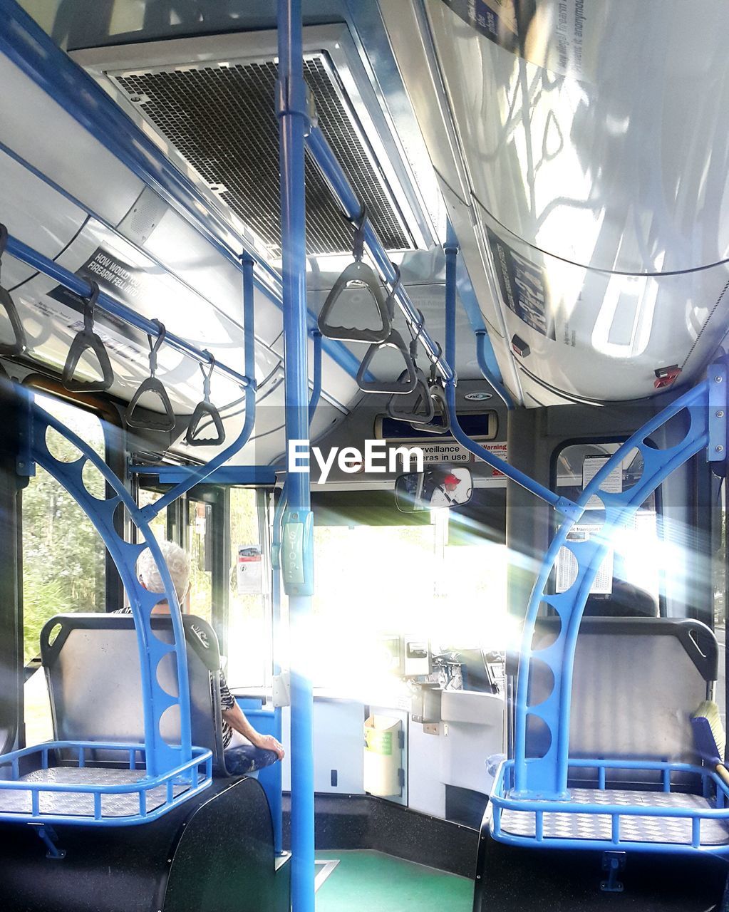 Senior woman sitting on bus