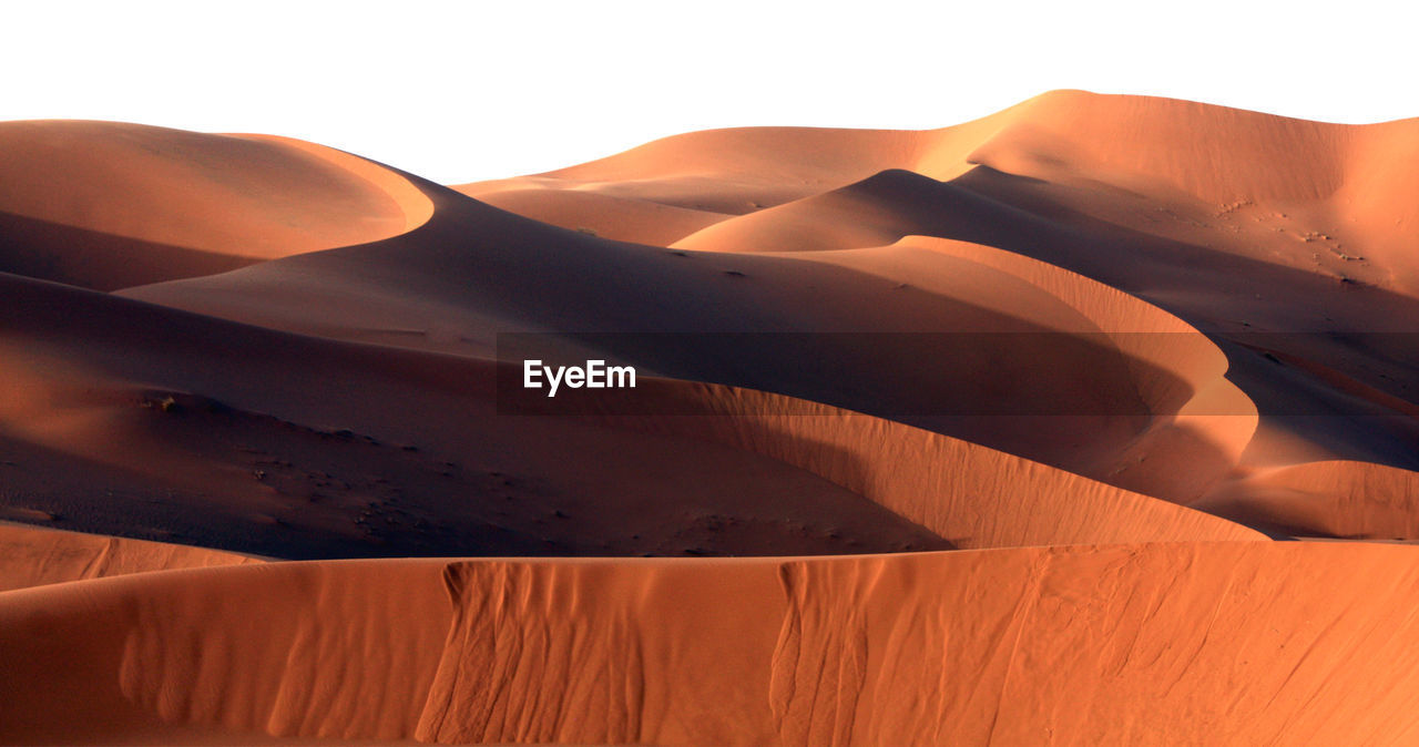 Scenic view of sahara desert against clear sky