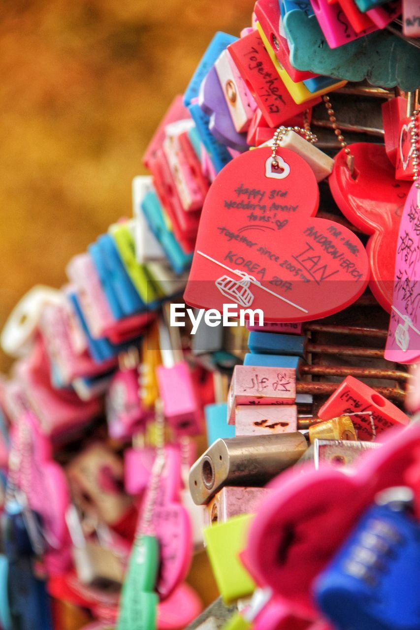 CLOSE-UP OF PADLOCKS HANGING ON DISPLAY