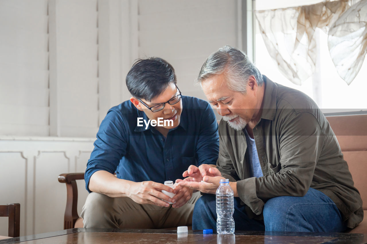 PEOPLE SITTING ON TABLE