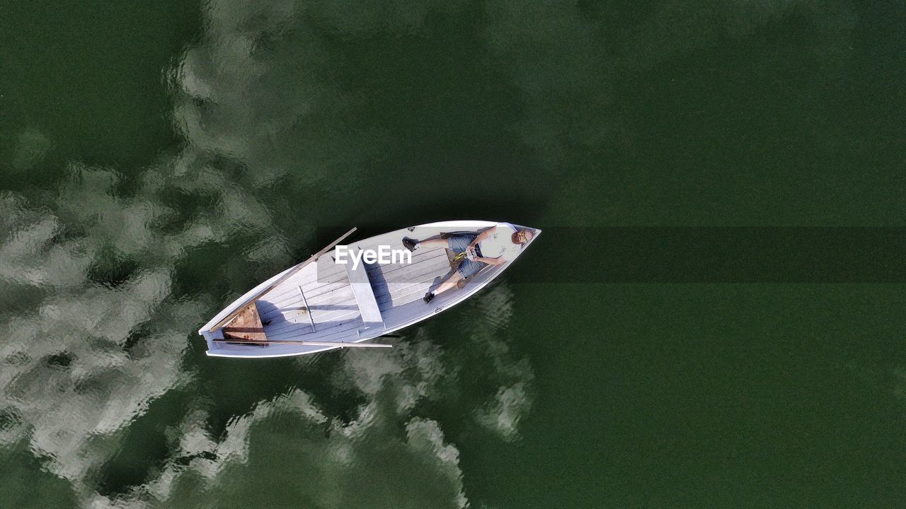 High angle view of man in boat on sea