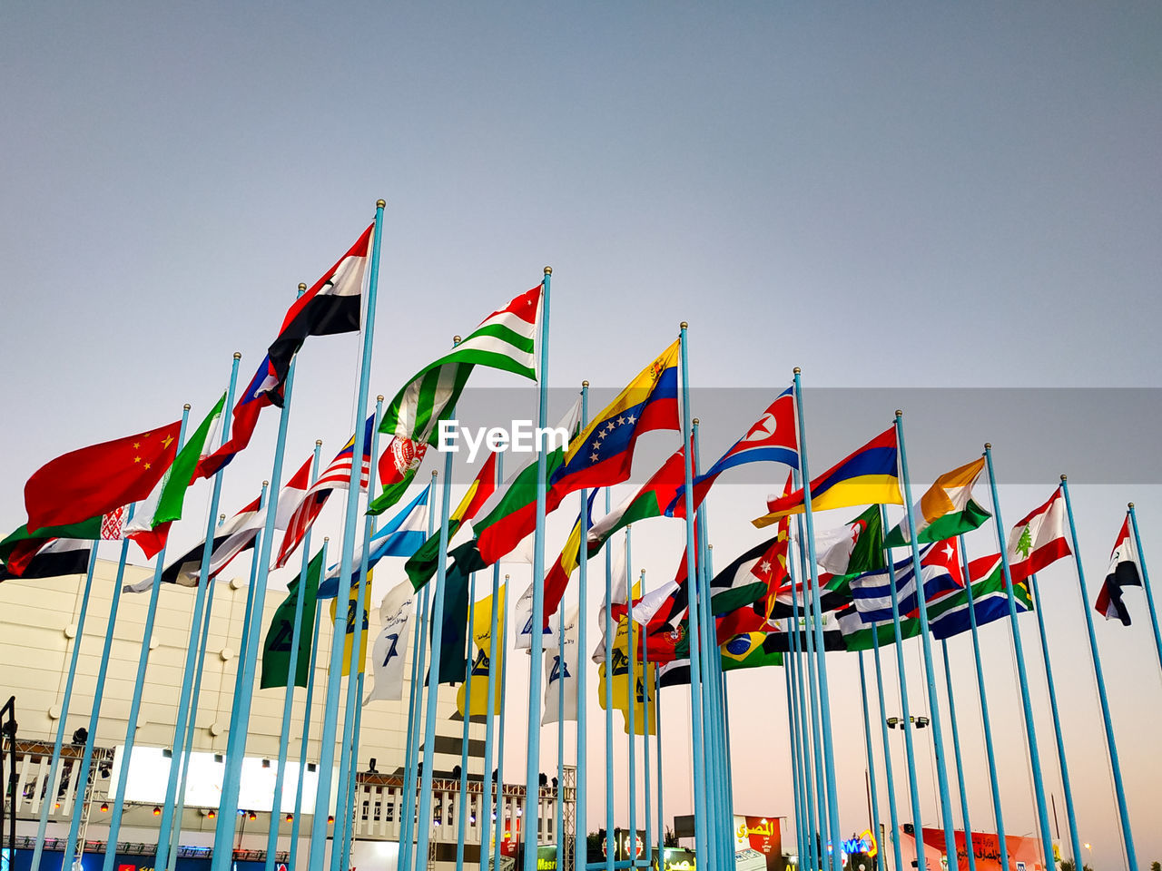 LOW ANGLE VIEW OF FLAGS AGAINST SKY