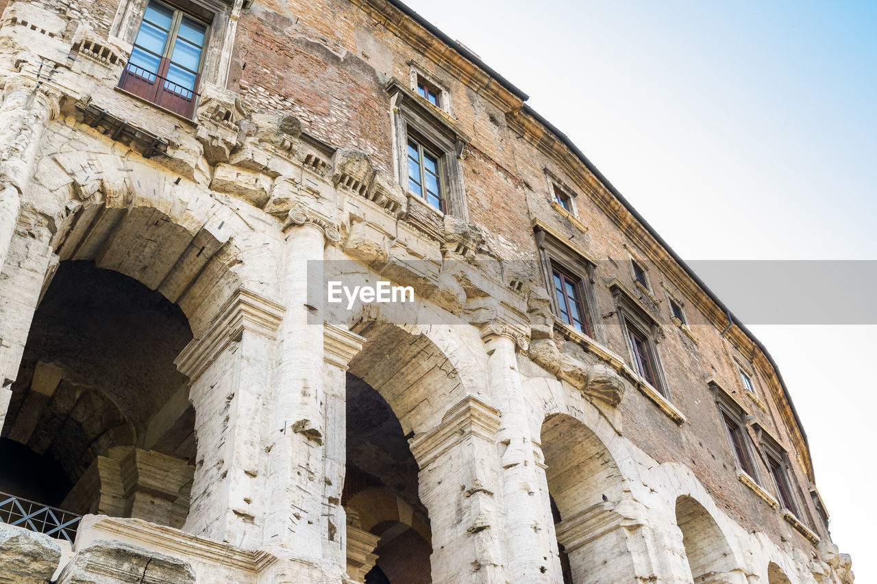 Low angle view of old building against clear sky