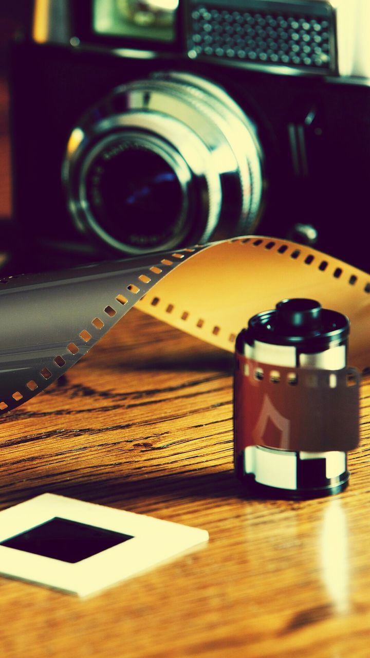 Camera film on wooden table