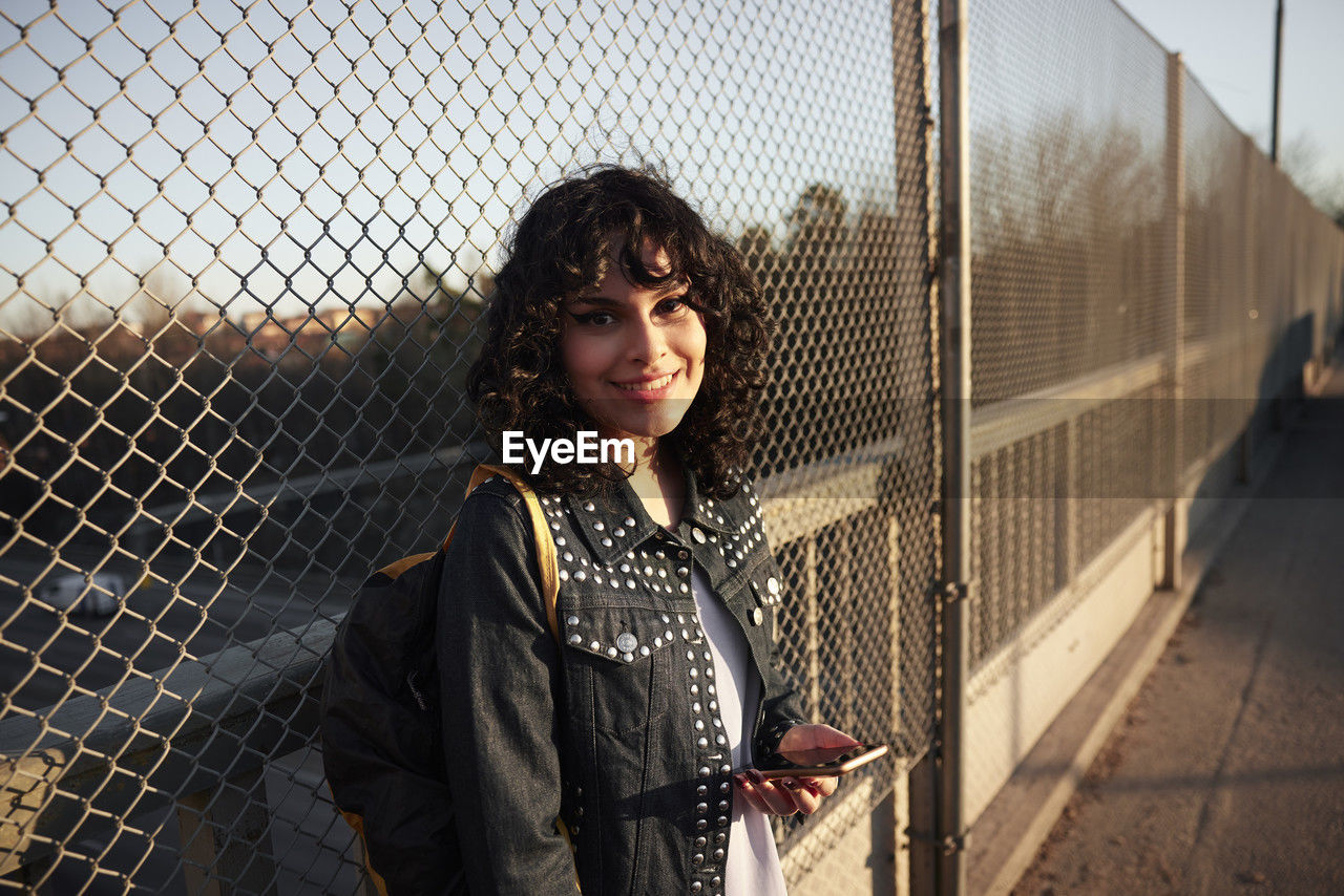 Portrait of smiling young woman looking at camera