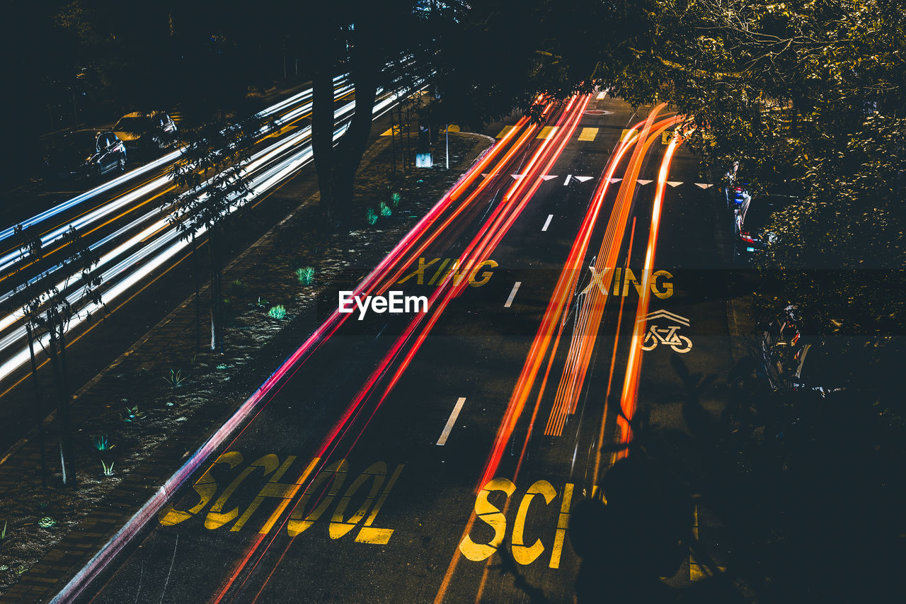 High angle view of light trails on road at night