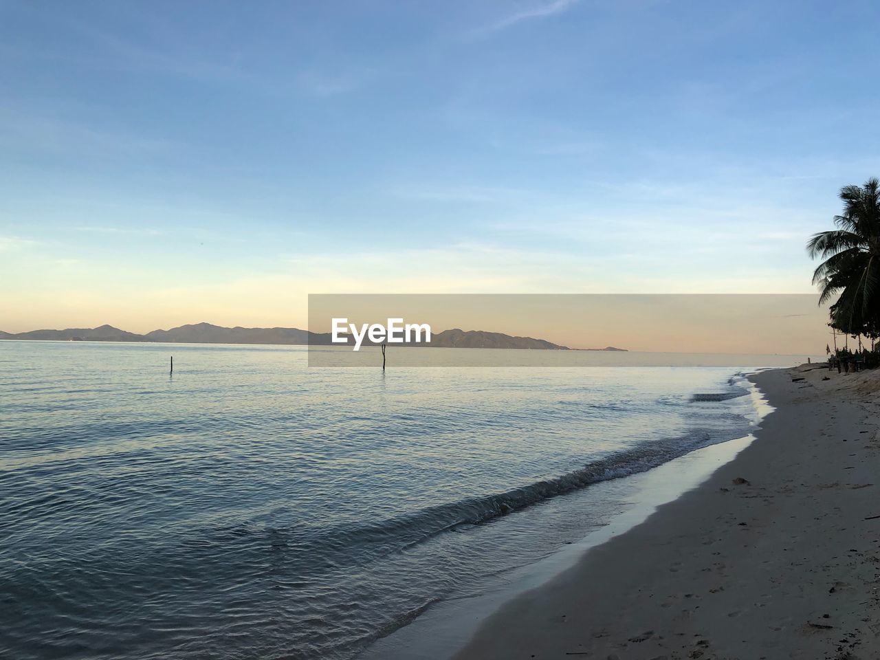 SCENIC VIEW OF BEACH DURING SUNSET