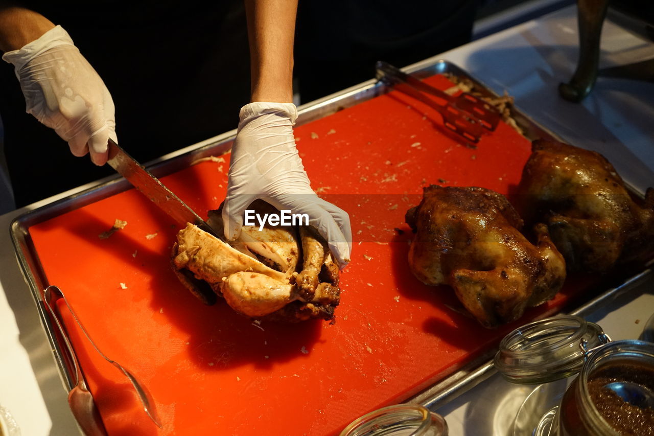 HIGH ANGLE VIEW OF PERSON PREPARING FOOD