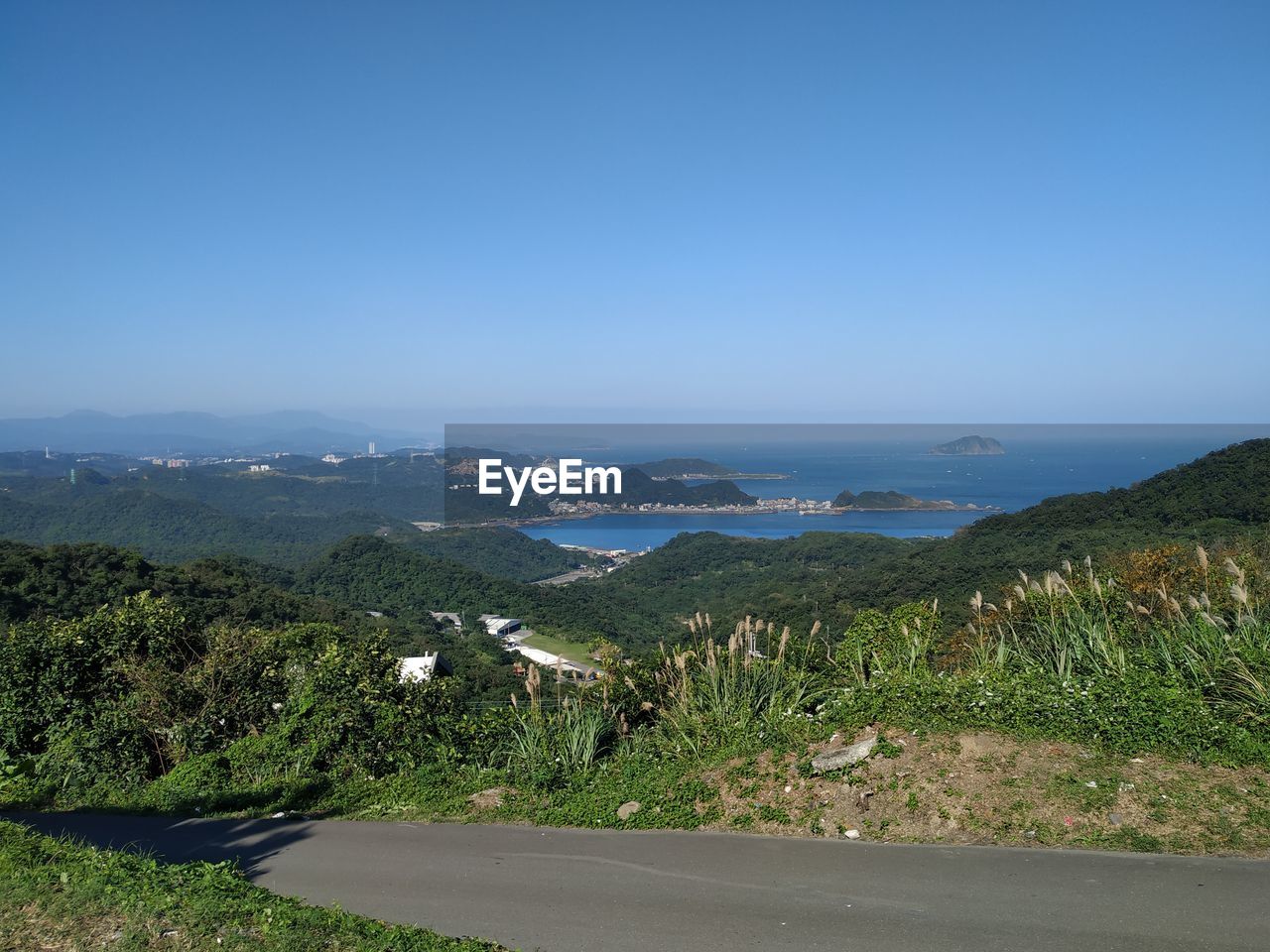 Scenic view of landscape against clear blue sky