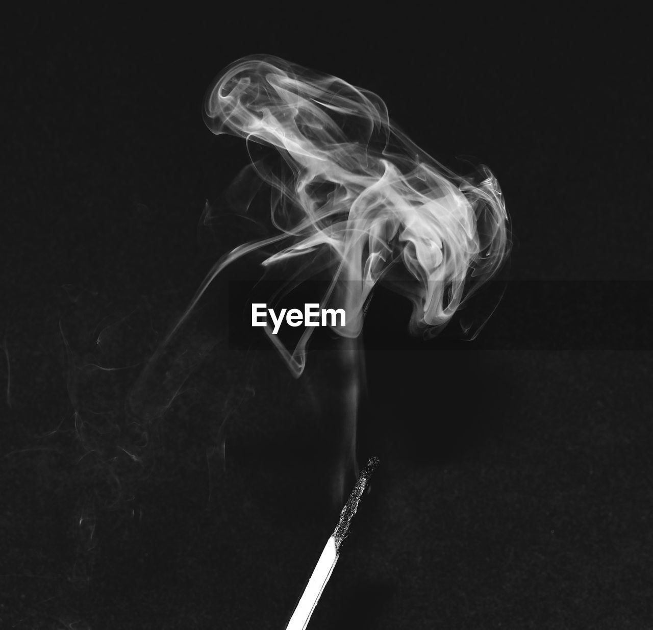 Close-up of smoke emitting from black background