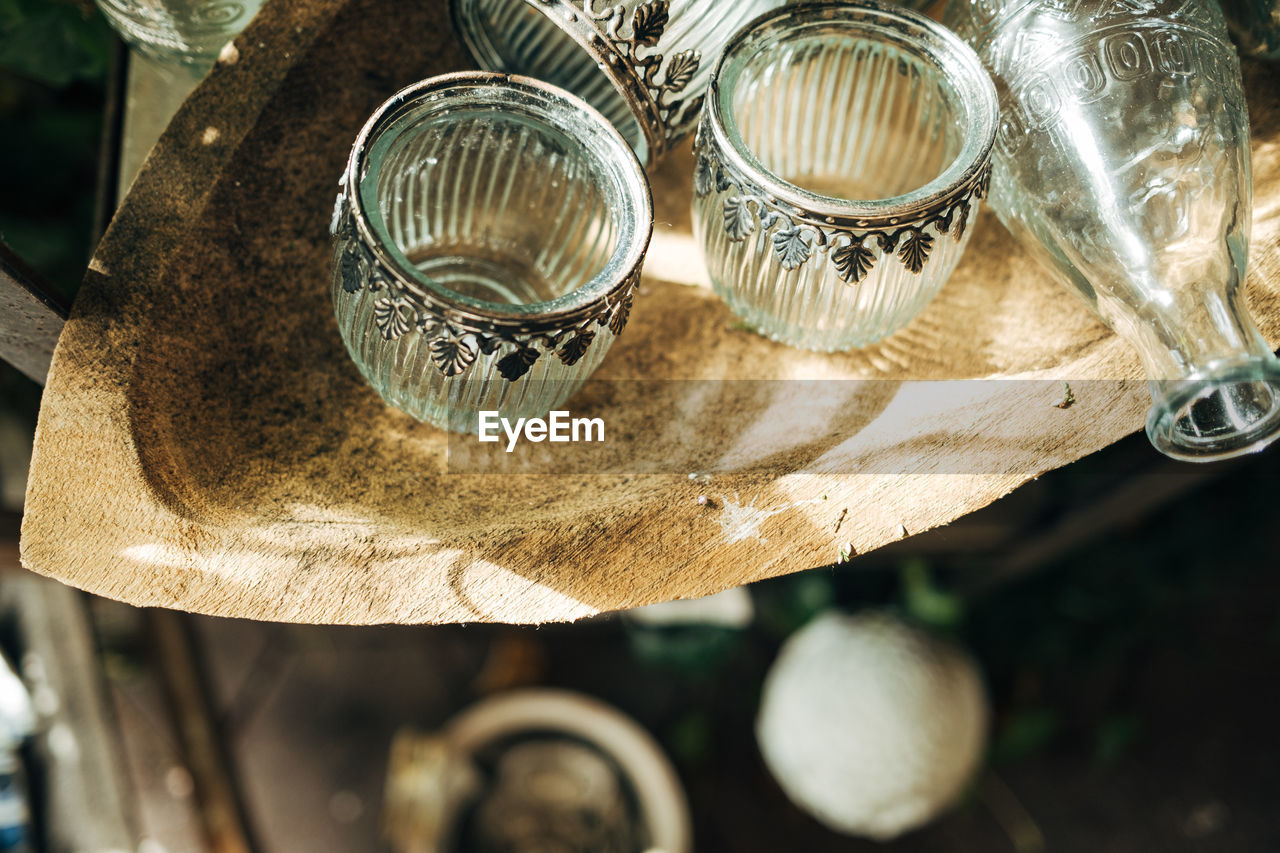 Glass vases in wooden bowl